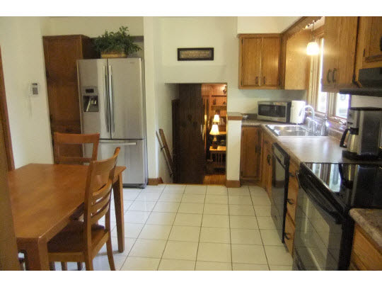 4854 Braewild Road Rockford, IL 61107 - Photo 4 of 11 a kitchen with stainless steel appliances granite countertop a refrigerator and a stove