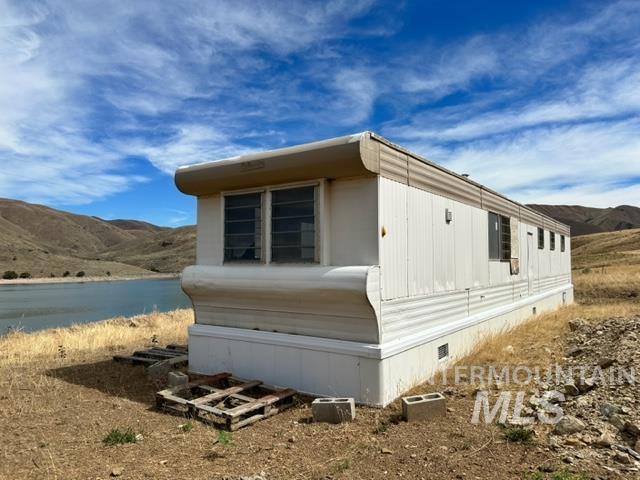 32214 Snake River Road Huntington, OR 97907 - Photo 17 of 31 View of property exterior featuring a mountain view and crawl space