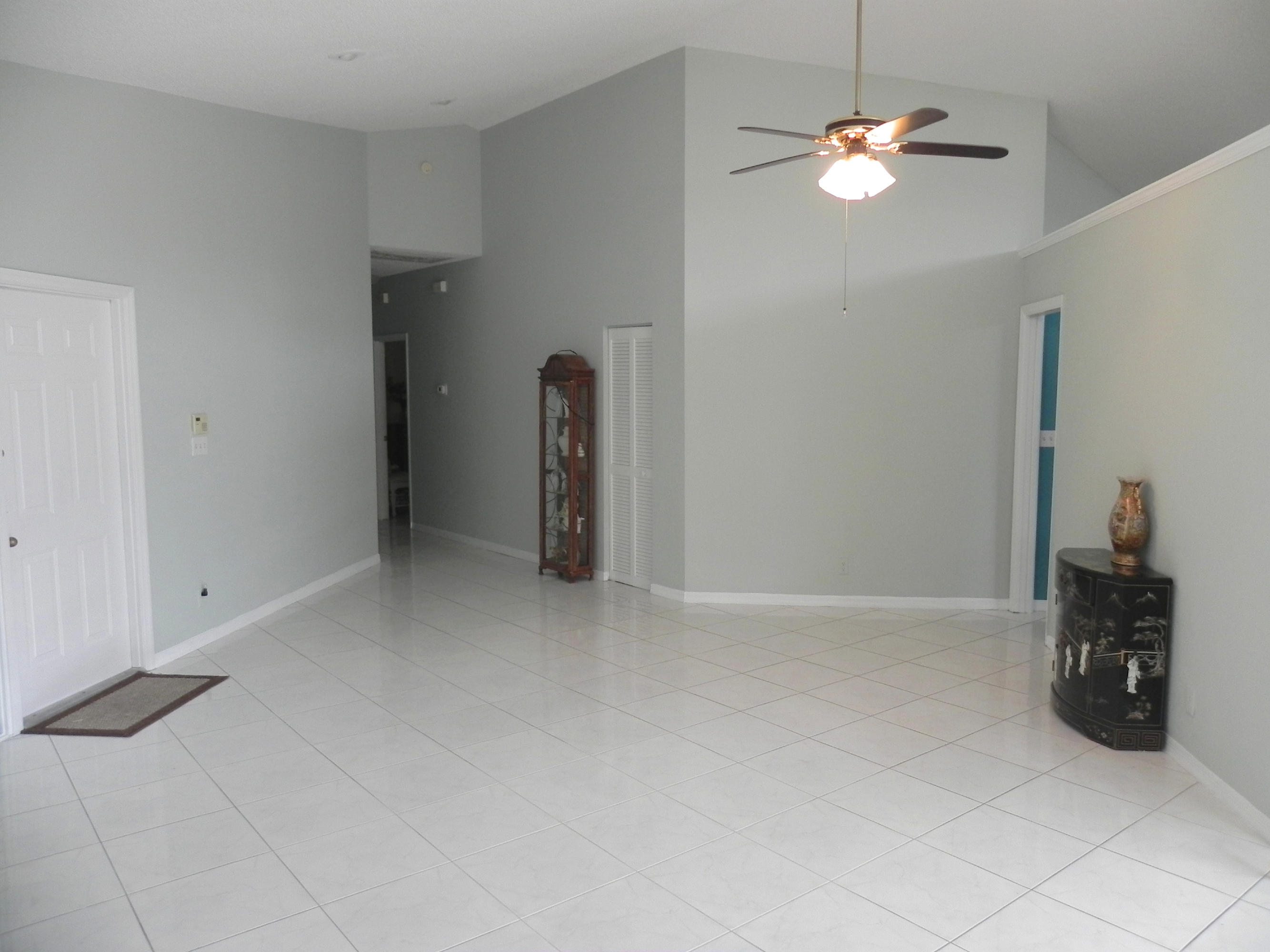 8609 Vía Giula Boca Raton, FL 33496 - Photo 19 of 40 Living space leading to bedroom wing