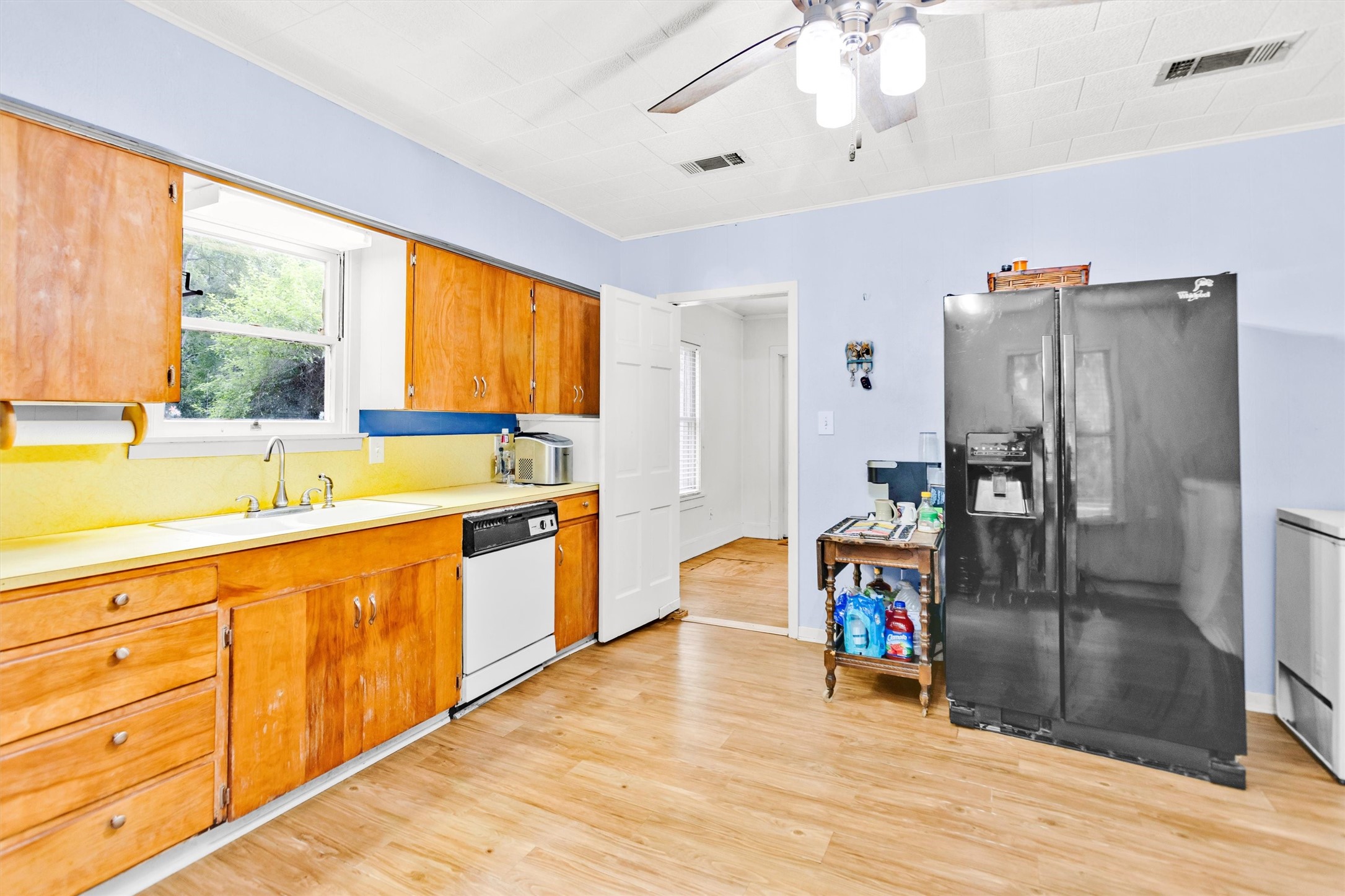 1720 18th Street Huntsville, TX 77340 - Photo 15 of 37 a kitchen with stainless steel appliances granite countertop a refrigerator and a sink
