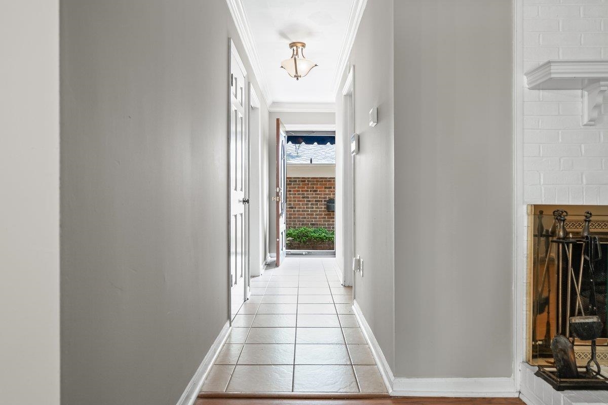6942 Amberly Road, Unit 6942 Memphis, TN 38119 - Photo 4 of 23 a view of a hallway with wooden floor and a bathroom