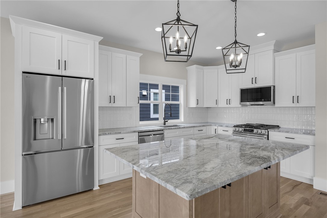 1230 Melton Road, Unit 216 West Union, SC 29696 - Photo 9 of 49 Culinary dreams come alive in this kitchen featuring abundant white cabinetry and striking granite countertops.