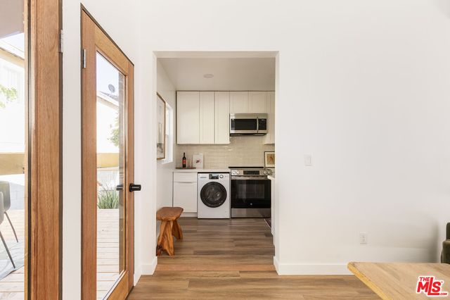a view of a kitchen cabinets and wooden floor