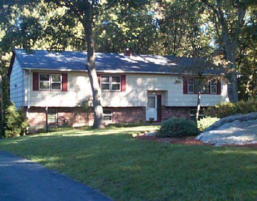 14 Jangling Plain Road Newtown, CT 06470 - Photo 1 of 1 a front view of a house with a yard and garage