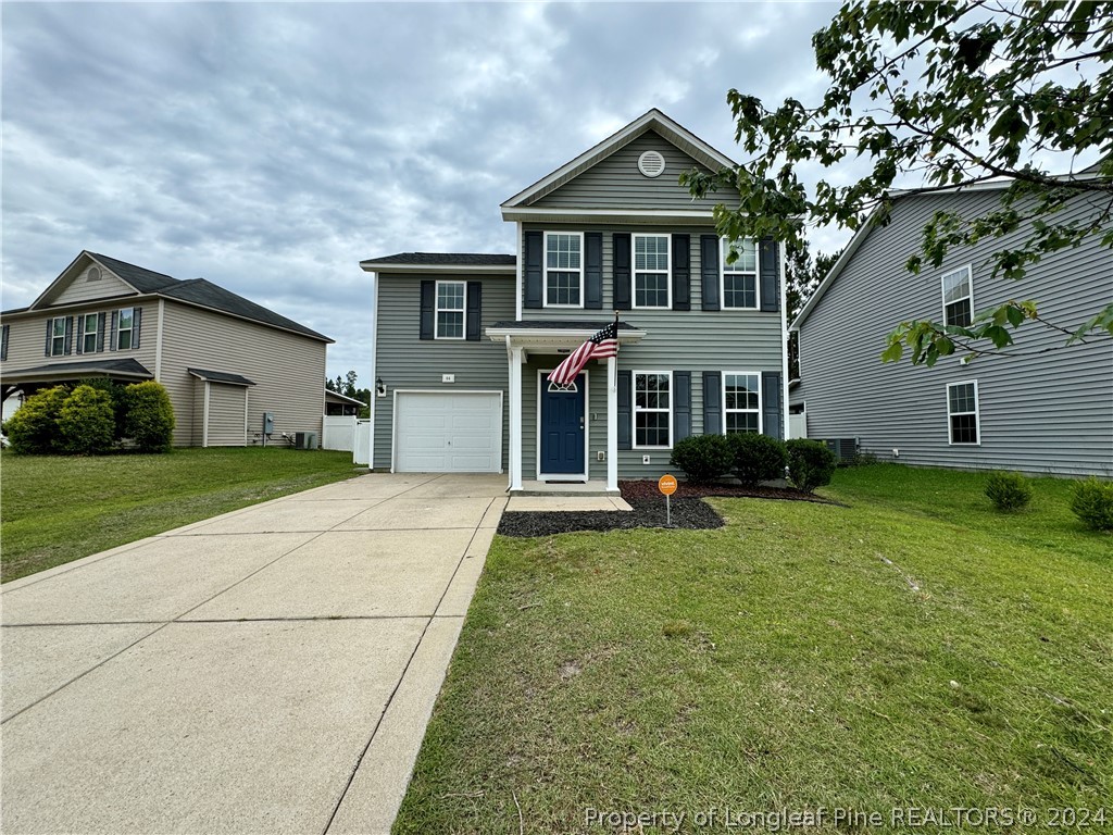 66 Loyalist Road Cameron, NC 28326 - Photo 1 of 24 a front view of a house with a yard