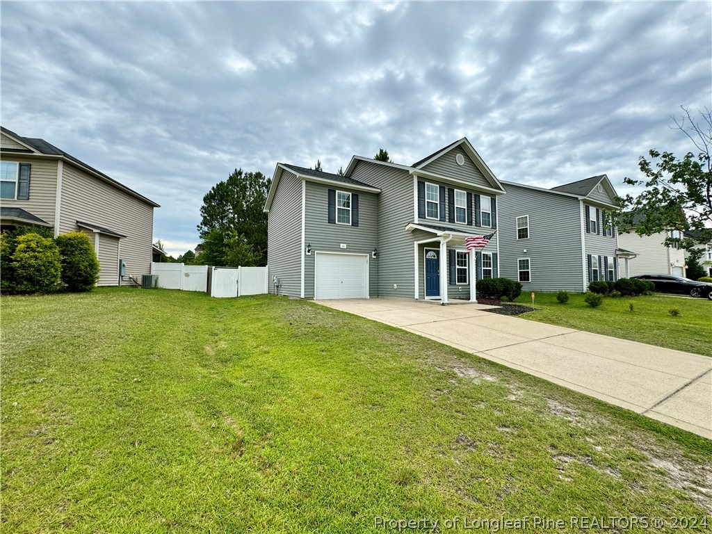 66 Loyalist Road Cameron, NC 28326 - Photo 2 of 24 a front view of a house with garden
