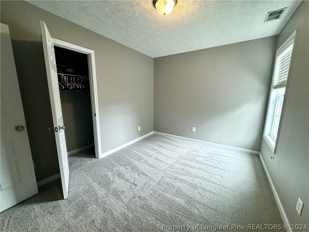 66 Loyalist Road Cameron, NC 28326 - Photo 22 of 24 an empty room with closet