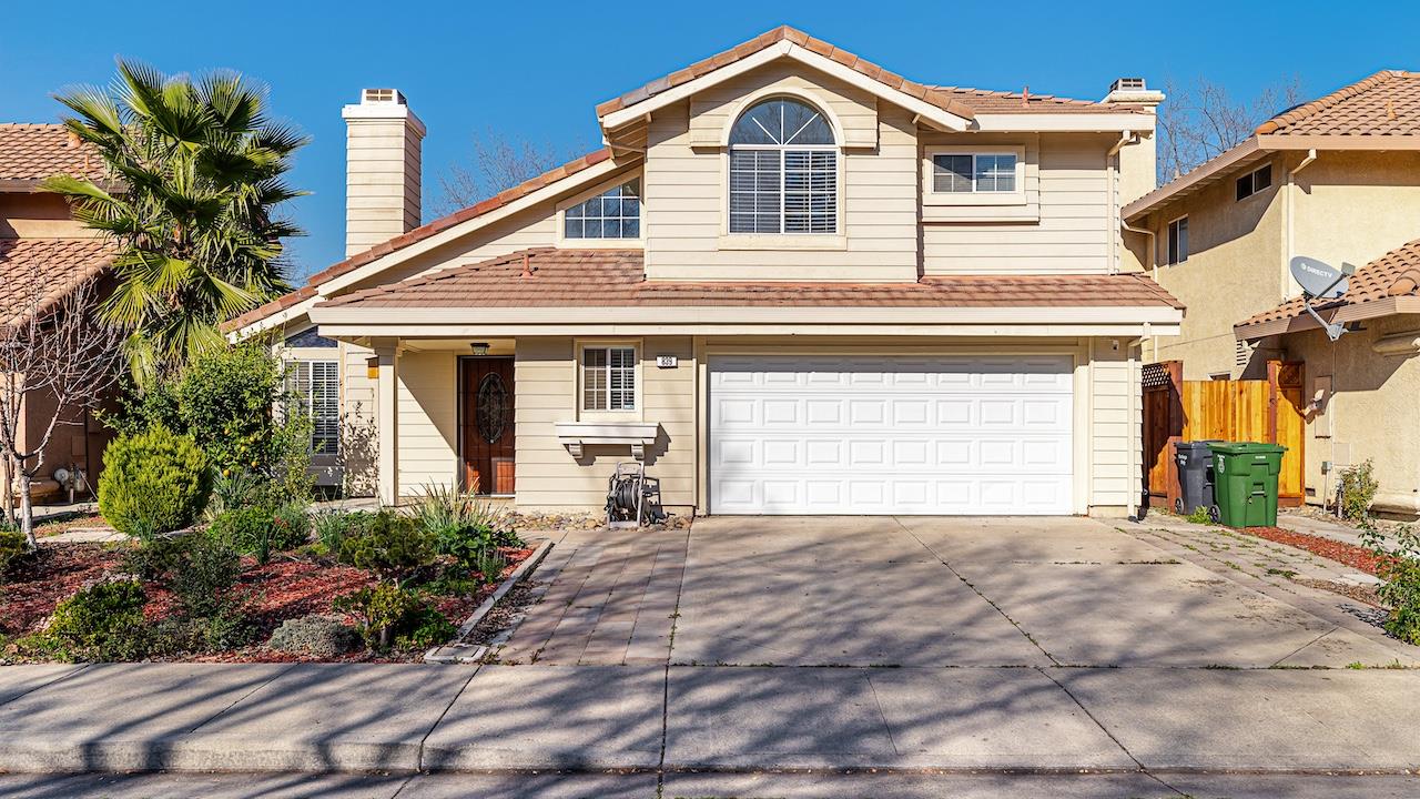 839 Williams Street Tracy, CA 95376 - Photo 1 of 42 a front view of a house with a yard and garage