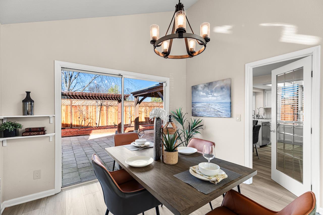 839 Williams Street Tracy, CA 95376 - Photo 15 of 42 a dining room with furniture a chandelier and wooden floor