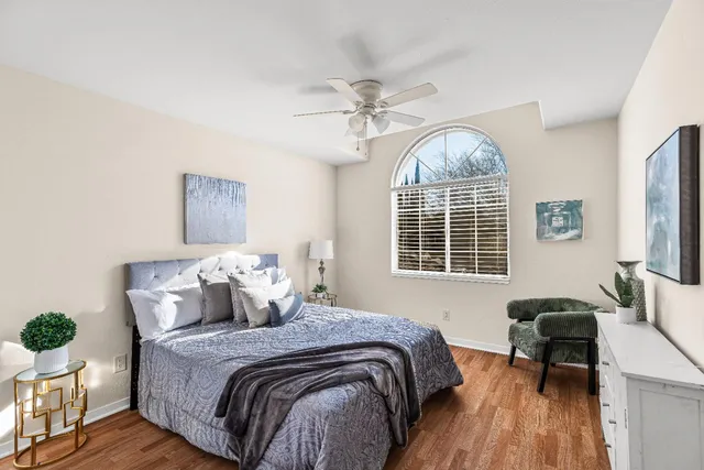 a bedroom with bed and a window