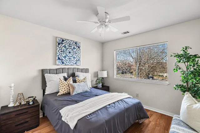 a bedroom with a bed and a window