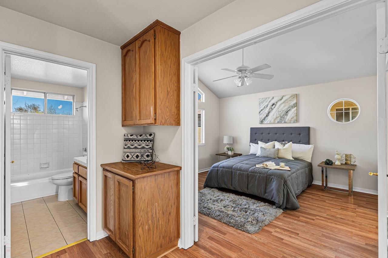 839 Williams Street Tracy, CA 95376 - Photo 28 of 42 a bedroom with a bed and a table in it