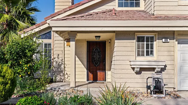 a front view of a house with glass windows