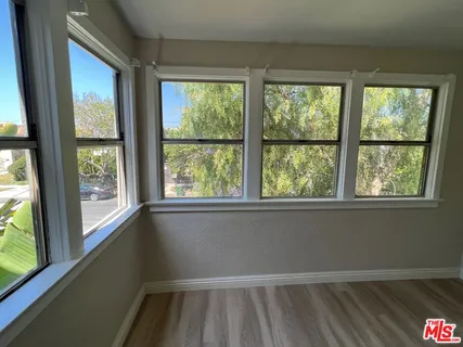 a kitchen with a sink refrigerator and microwave