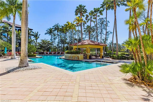 a view of a swimming pool with a lounge chairs