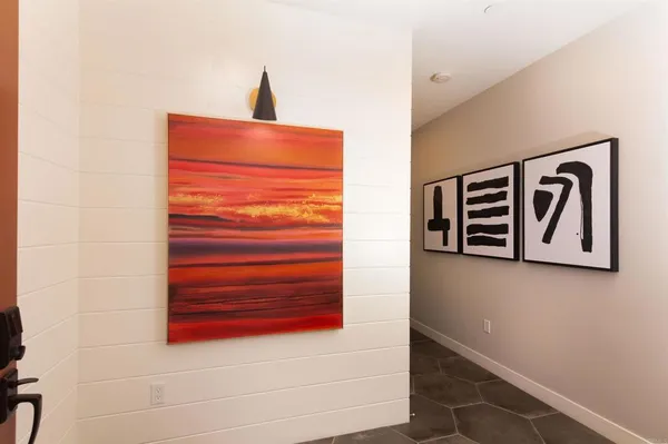 a area with wooden floor and a sink