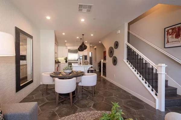 a dining room with furniture and entryway