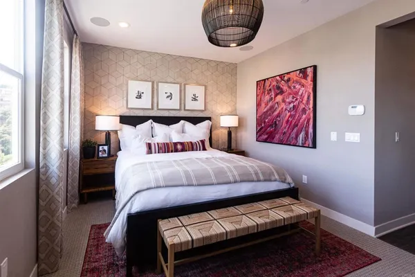 a bathroom with a double vanity sink a mirror and a shower