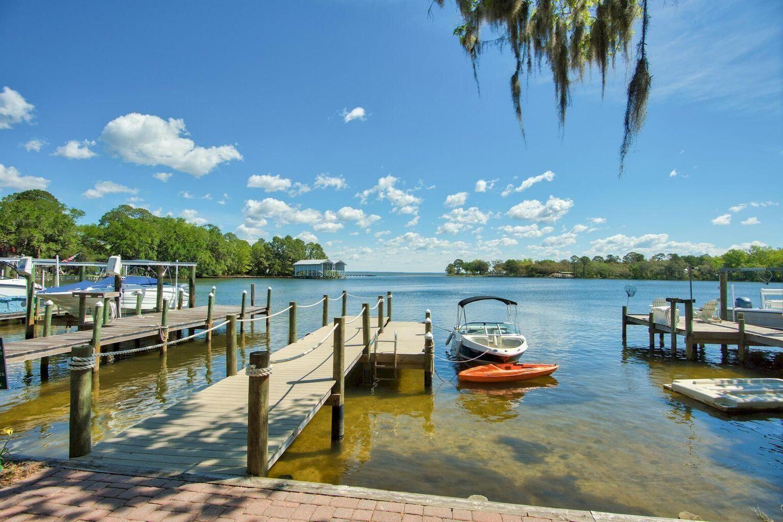 30 Beacon Point Drive Santa Rosa Beach, FL 32459 - Photo 13 of 53 a view of a lake with boats and palm trees
