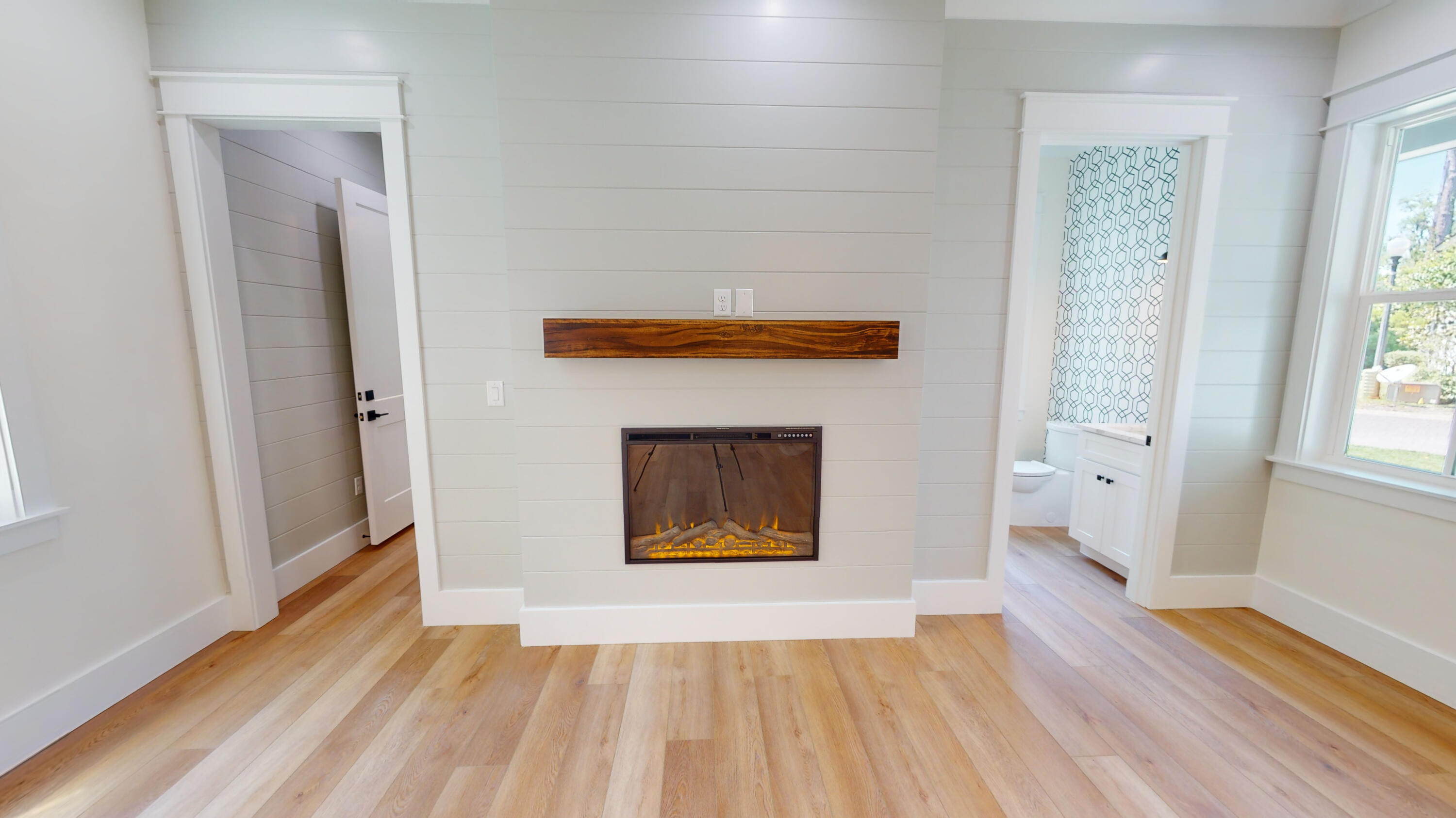 30 Beacon Point Drive Santa Rosa Beach, FL 32459 - Photo 15 of 53 a view of a livingroom with wooden floor and a fireplace