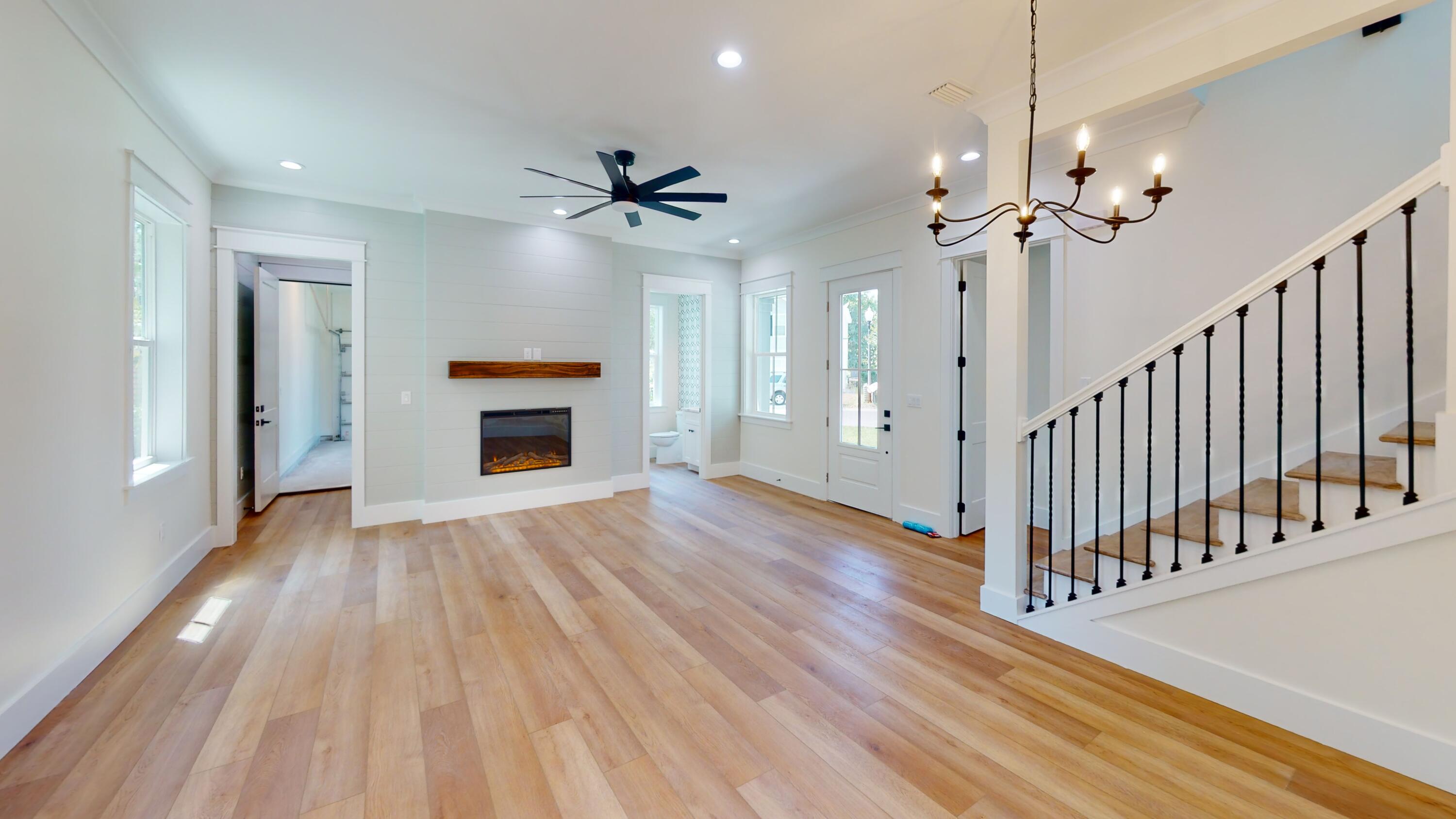 30 Beacon Point Drive Santa Rosa Beach, FL 32459 - Photo 19 of 53 a view of empty room with wooden floor and fan