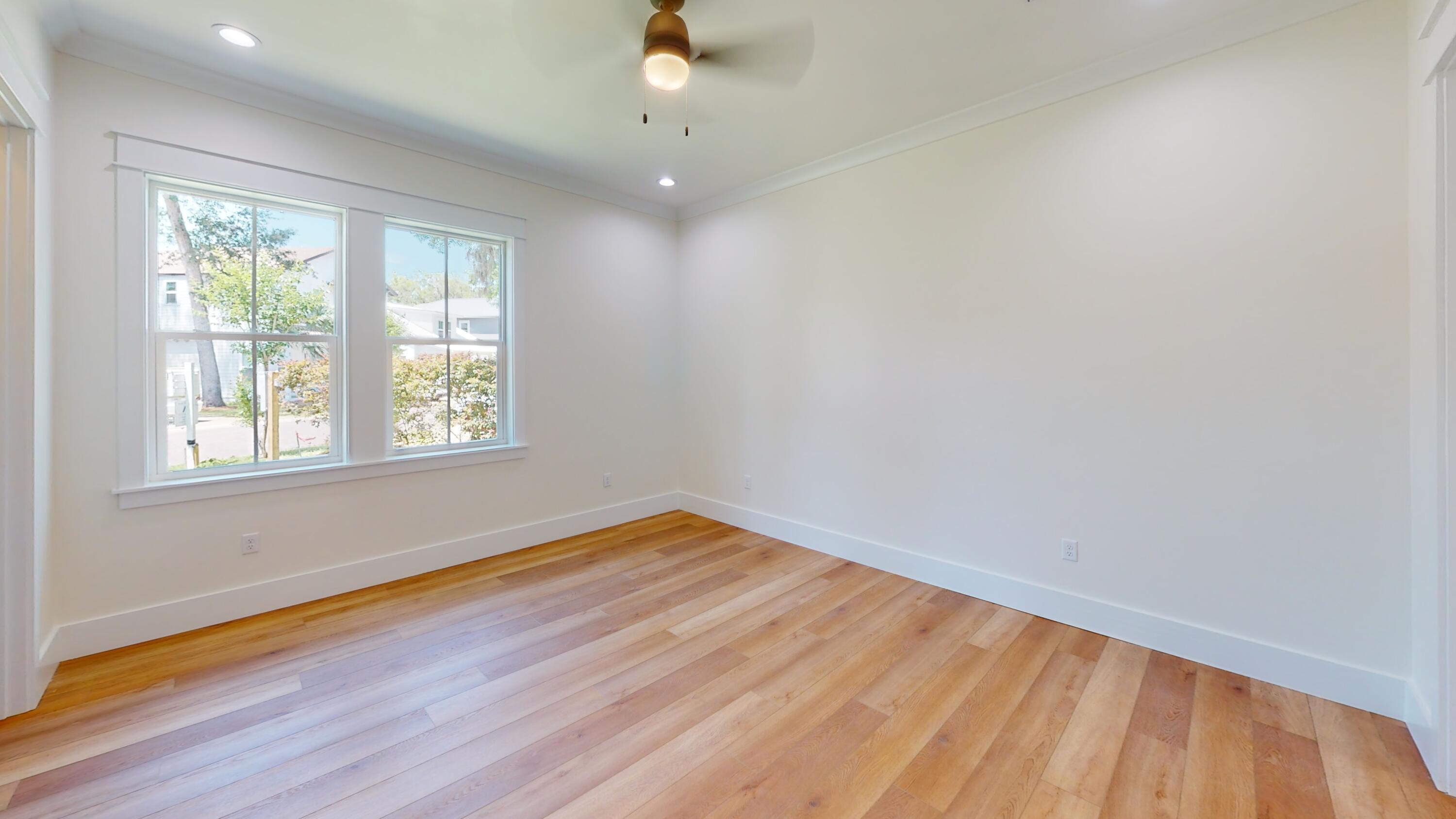 30 Beacon Point Drive Santa Rosa Beach, FL 32459 - Photo 34 of 53 an empty room with wooden floor and windows