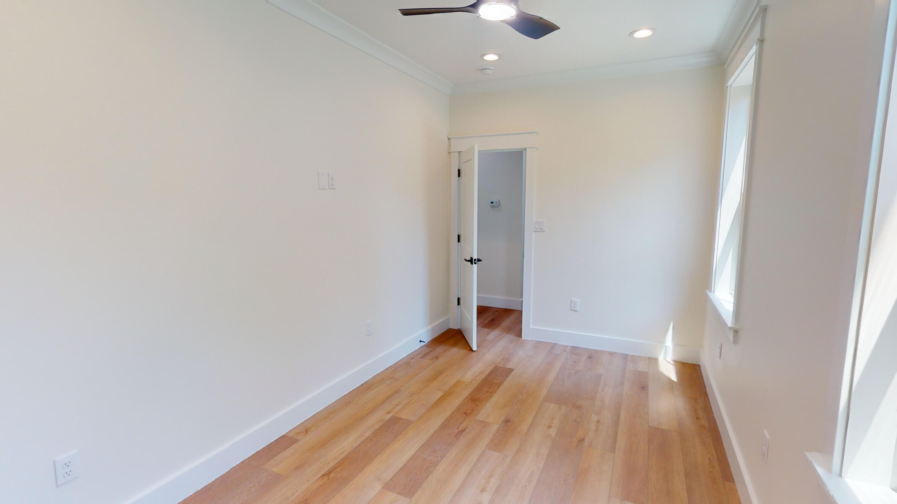 30 Beacon Point Drive Santa Rosa Beach, FL 32459 - Photo 46 of 53 wooden floor in an empty room with a window