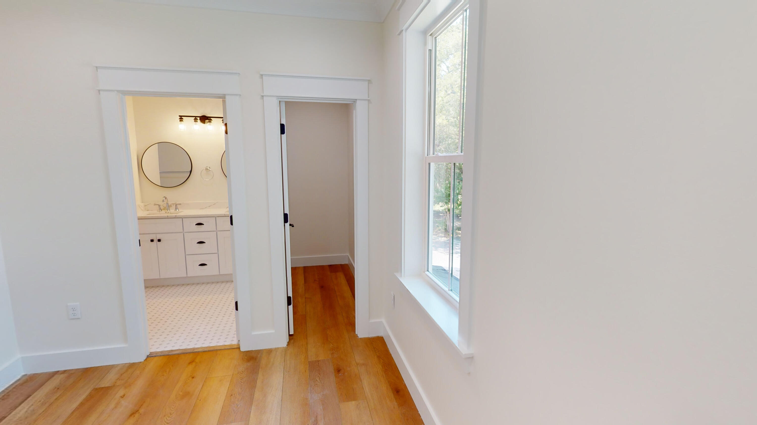 30 Beacon Point Drive Santa Rosa Beach, FL 32459 - Photo 48 of 53 a view of a hallway with wooden floor and closet