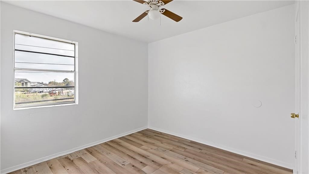 2712 Evergreen Circle Bryan, TX 77801 - Photo 17 of 30 Empty room with ceiling fan and light wood-type flooring