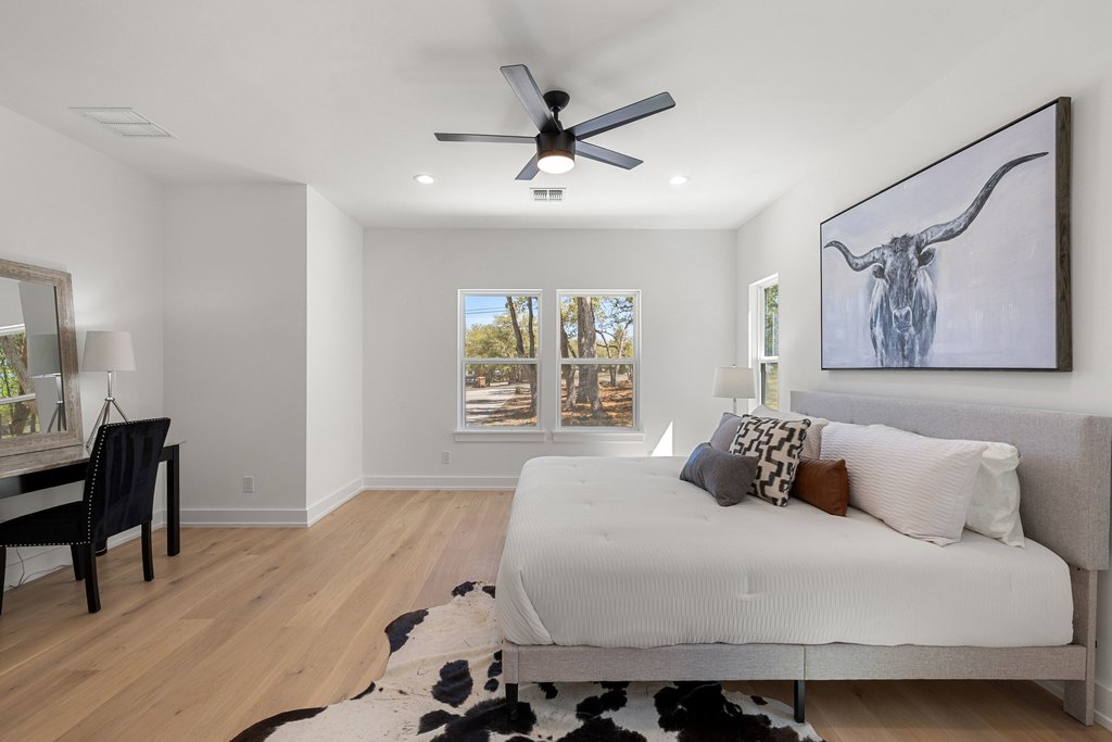 408 Rust Ranch Road Blanco, TX 78606 - Photo 13 of 34 Bedroom featuring light wood-style floors, a ceiling fan, and recessed lighting