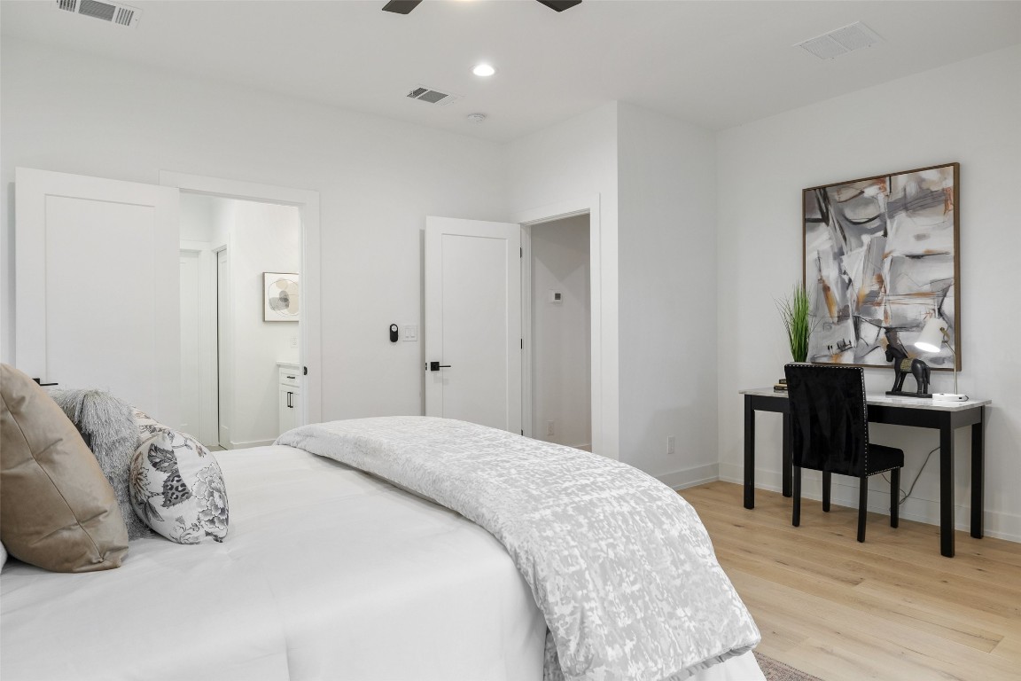 408 Rust Ranch Road Blanco, TX 78606 - Photo 22 of 35 a bedroom with a bed and a table in it