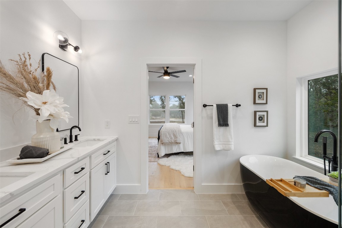 408 Rust Ranch Road Blanco, TX 78606 - Photo 24 of 35 a en suite spacious bathroom with double sink and mirror