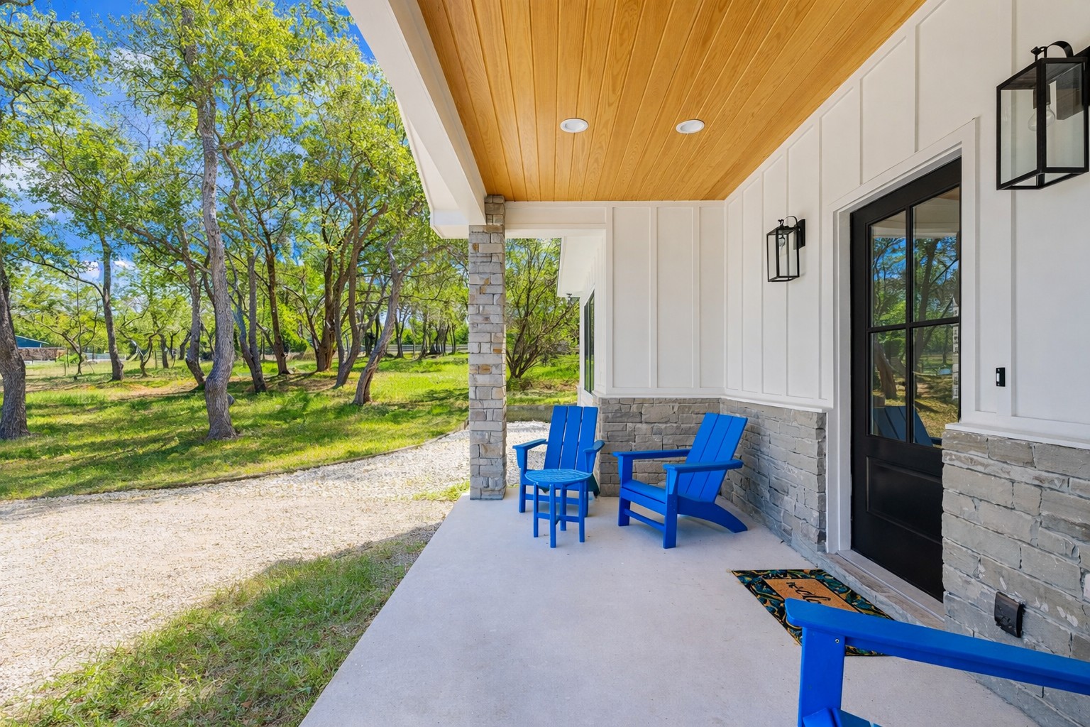 408 Rust Ranch Road Blanco, TX 78606 - Photo 25 of 34 Covered porch featuring a yard