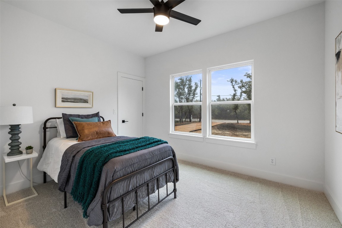 408 Rust Ranch Road Blanco, TX 78606 - Photo 28 of 35 a bedroom with a bed and window