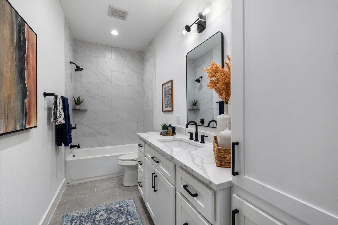 408 Rust Ranch Road Blanco, TX 78606 - Photo 30 of 35 a bathroom with a sink a toilet and shower