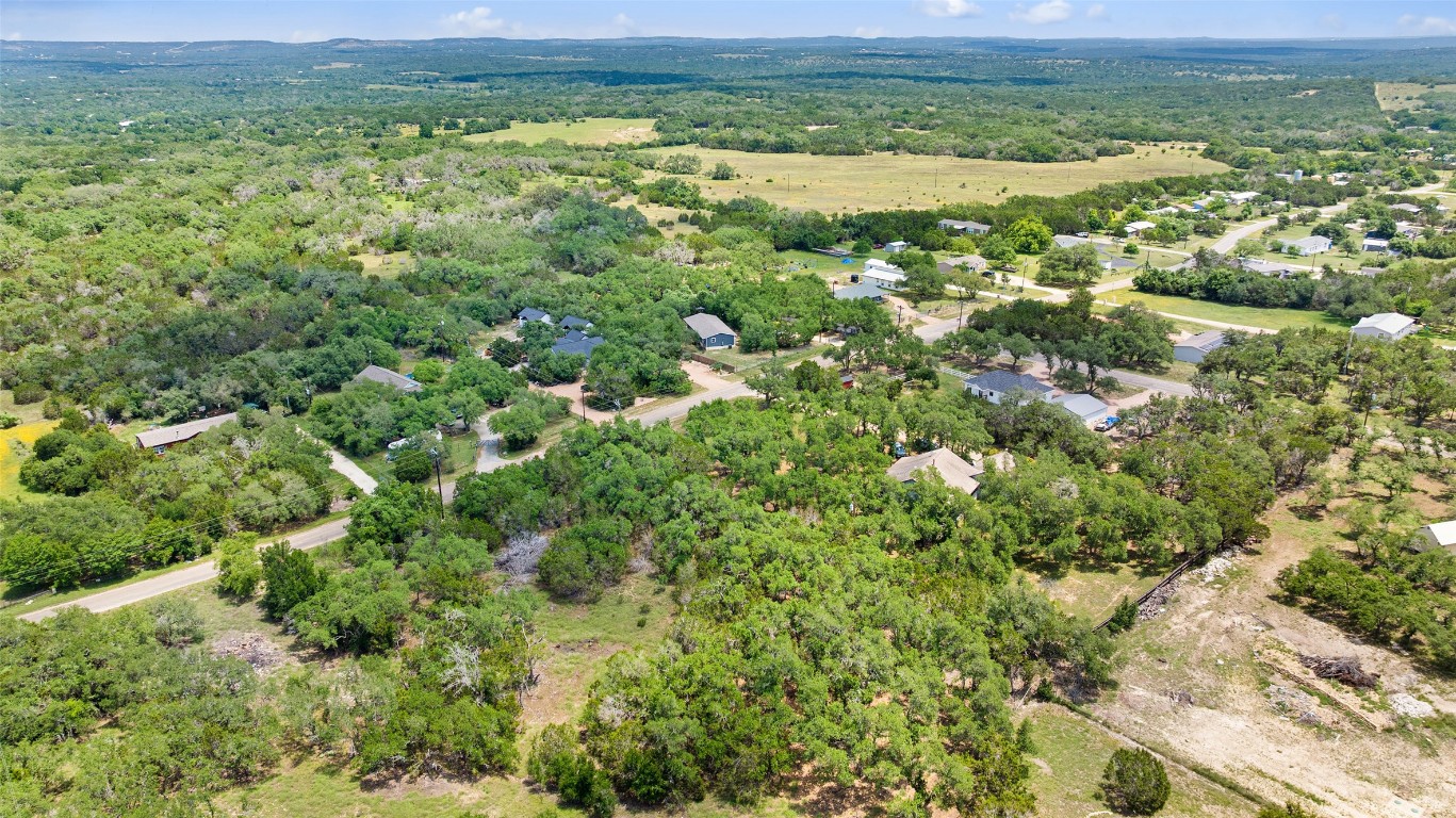 408 Rust Ranch Road Blanco, TX 78606 - Photo 4 of 35 a view of a field with an ocean view