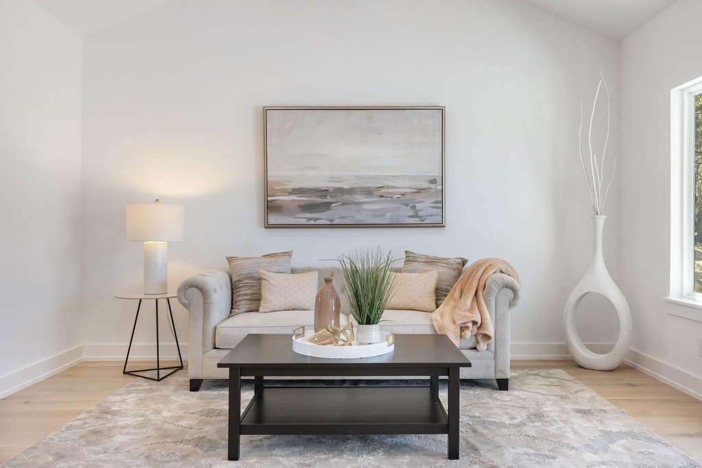 408 Rust Ranch Road Blanco, TX 78606 - Photo 7 of 34 Living area featuring light wood finished floors, vaulted ceiling, and healthy amount of natural light