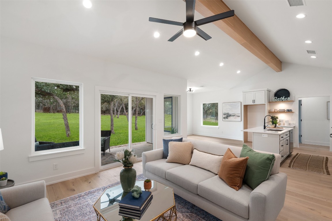 408 Rust Ranch Road Blanco, TX 78606 - Photo 10 of 35 a living room with furniture and a large window