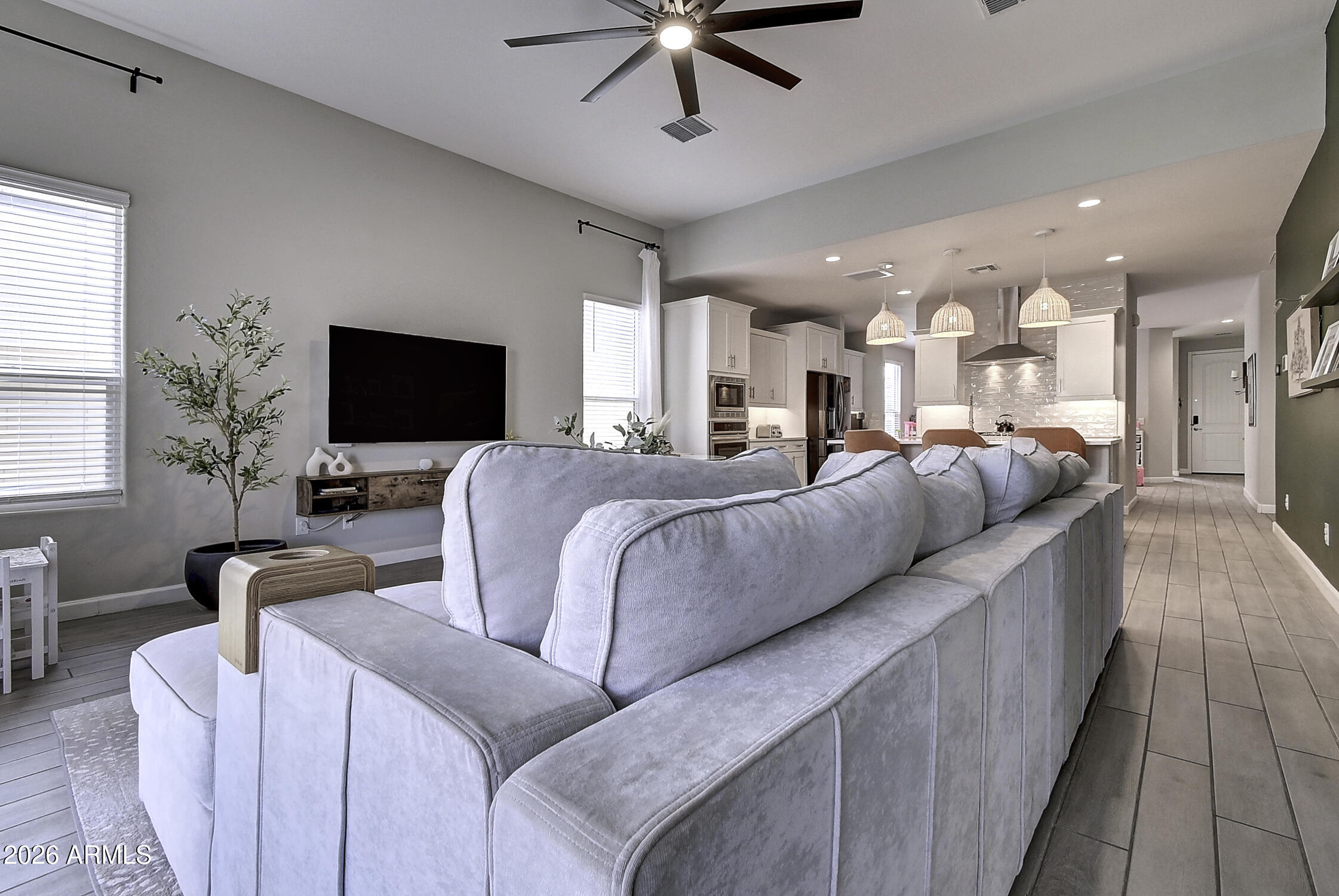 2140 East Alameda Road Phoenix, AZ 85024 - Photo 11 of 54 a living room with furniture and a flat screen tv