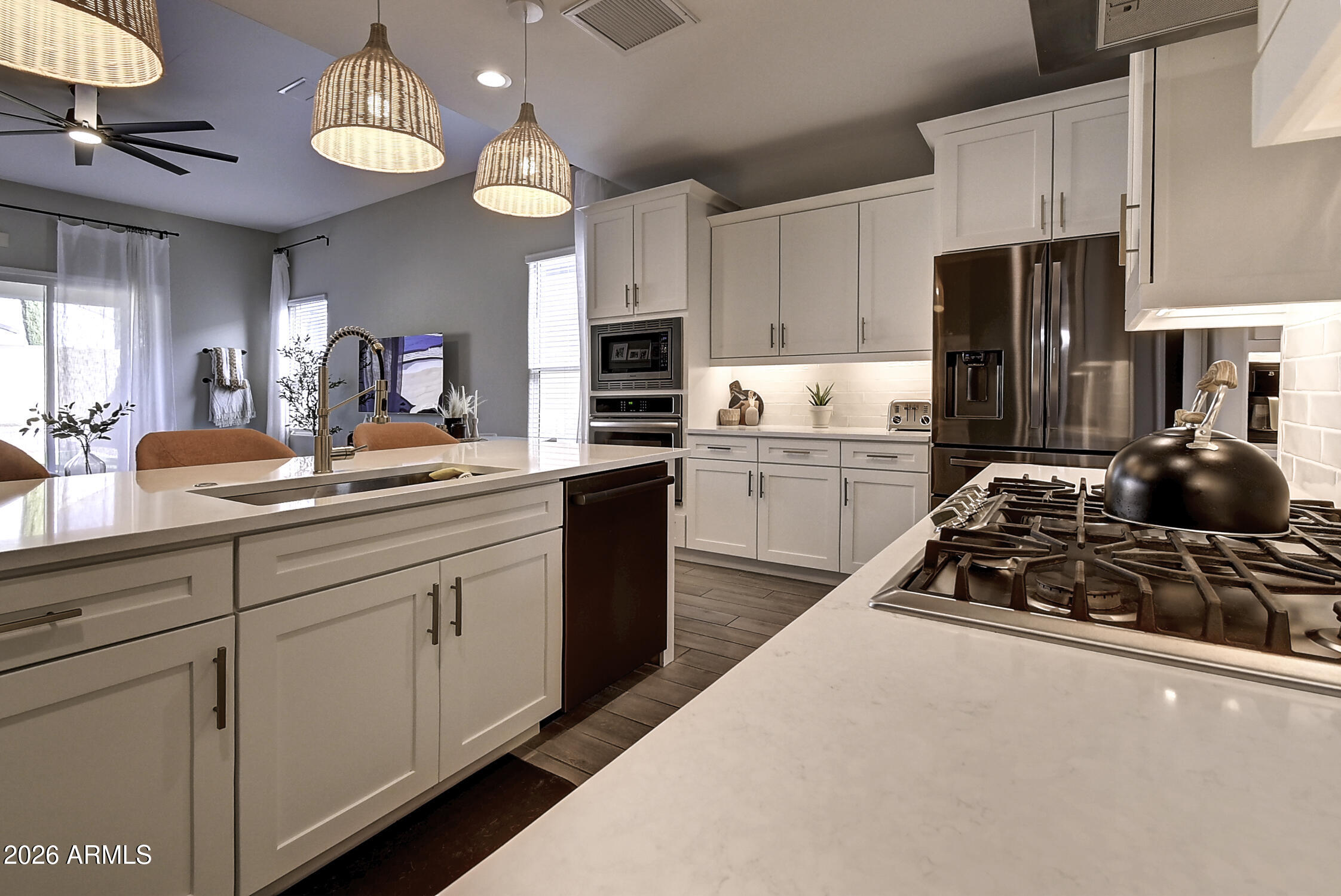 2140 East Alameda Road Phoenix, AZ 85024 - Photo 15 of 54 a kitchen with kitchen island granite countertop a sink a stove and refrigerator