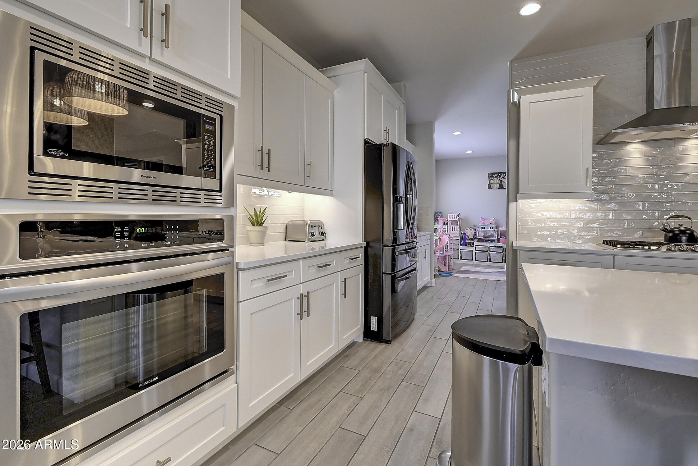 2140 East Alameda Road Phoenix, AZ 85024 - Photo 17 of 54 a kitchen with stainless steel appliances a stove microwave and refrigerator