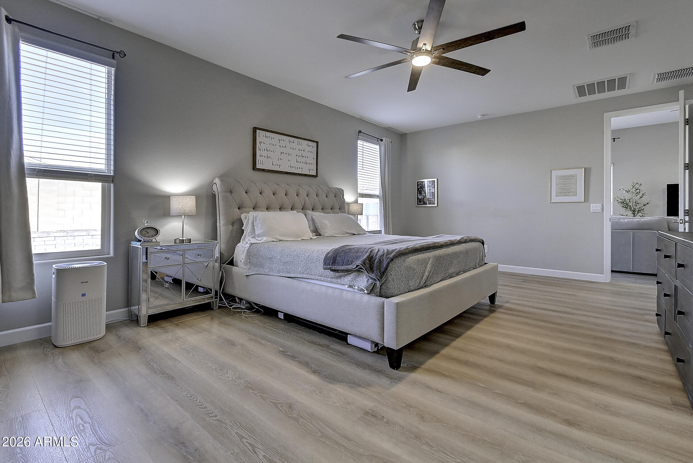 2140 East Alameda Road Phoenix, AZ 85024 - Photo 21 of 54 a bedroom with a bed and a chandelier