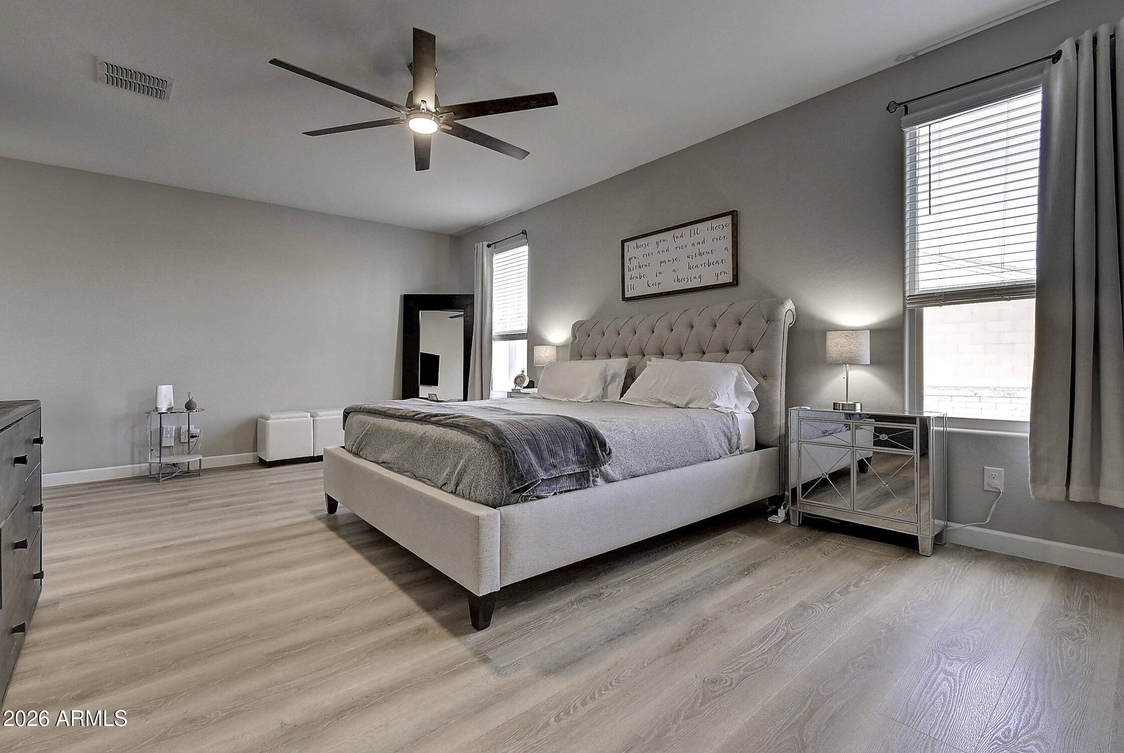 2140 East Alameda Road Phoenix, AZ 85024 - Photo 22 of 54 a spacious bedroom with a bed and a ceiling fan