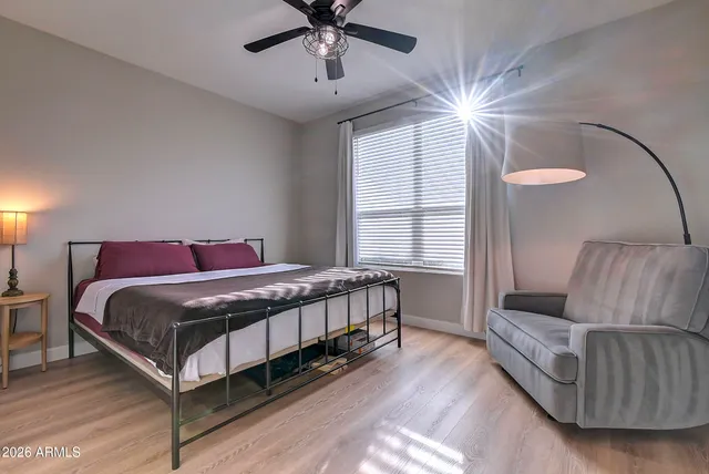 a bathroom with a sink toilet vanity and shower
