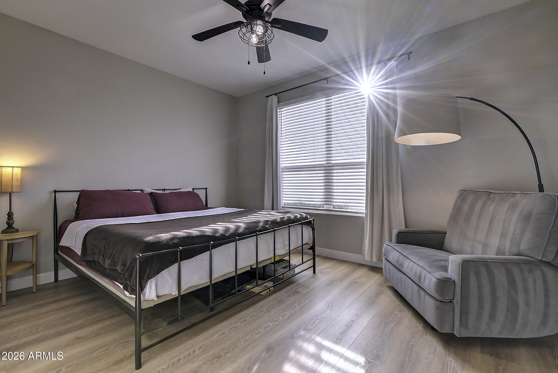 2140 East Alameda Road Phoenix, AZ 85024 - Photo 32 of 54 a bedroom with a bed and a chandelier