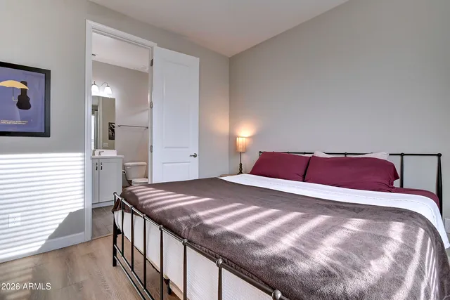 a bathroom with a double vanity sink mirror and toilet
