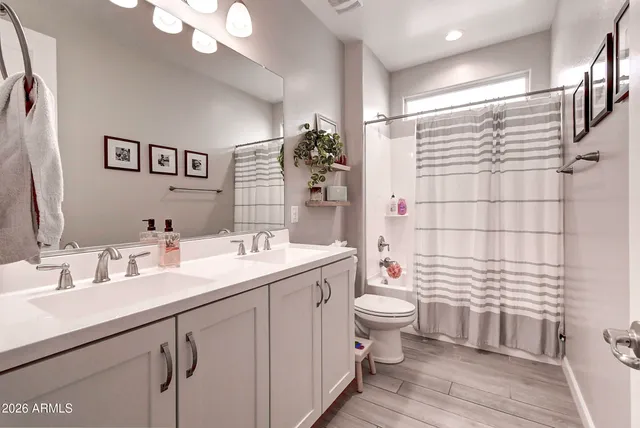 a bedroom with furniture and a bed