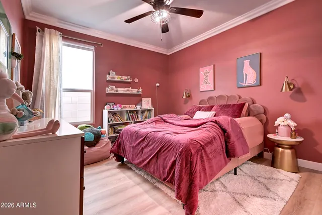 a bedroom with furniture and a window