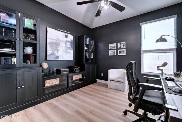 a bedroom with furniture and a window