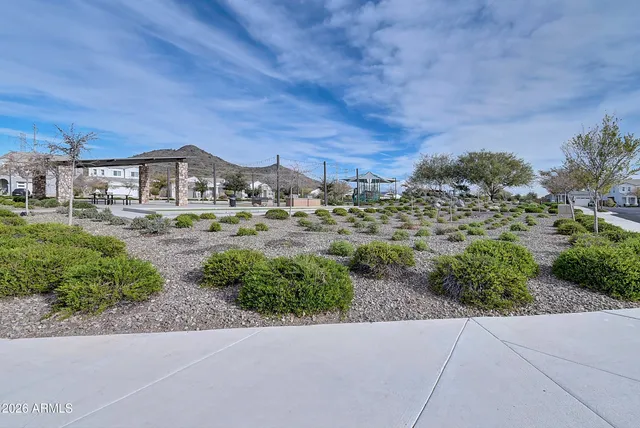 a view of patio with a table and chairs under an umbrella